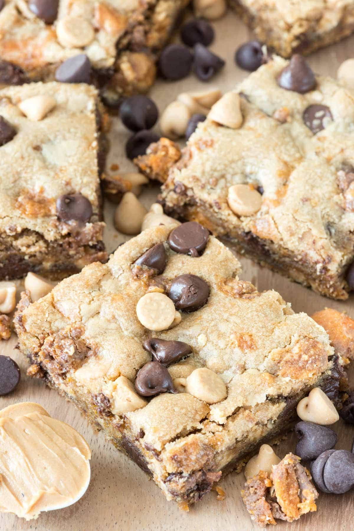 Triple Threat Peanut Butter Cookie Bars Recipe with peanut butter, peanut butter chips, Butterfingers, and chocolate!