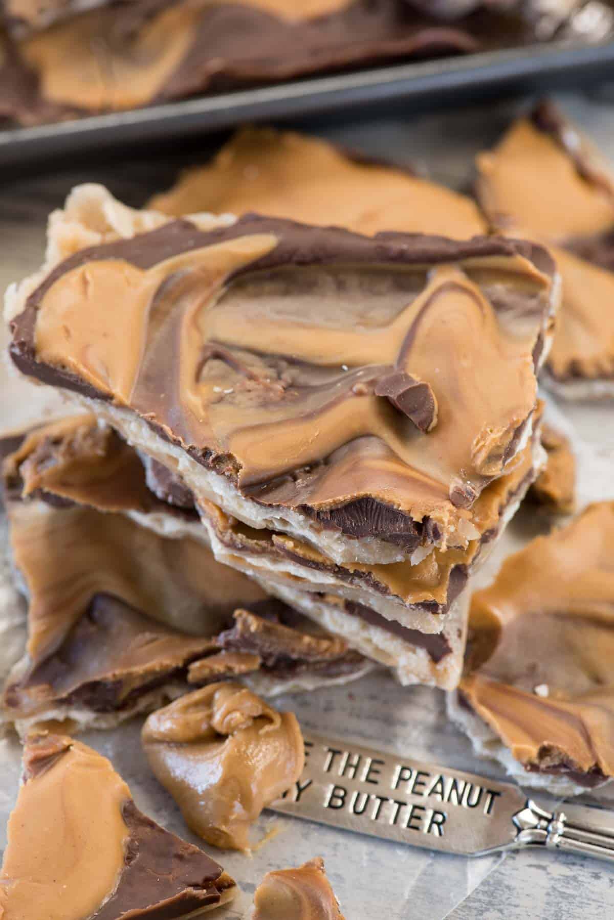 Peanut Butter Toffee Bark - this is the perfect crack bark recipe! Homemade toffee is baked on matzo crackers and topped with lots of chocolate and peanut butter. It's pure heaven and EVERYONE raves about it.