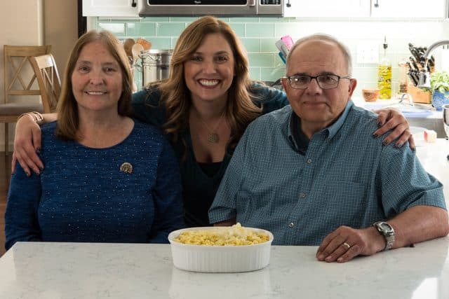 woman with parents in kitchen with knoepfle in dish