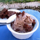 brownie batter ice cream in white dish on blue tablecloth outside with words
