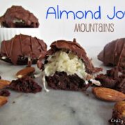 almond joy mountains - chocolate brownie bites with coconut topping and covered in chocolate on a marble slab with words on photo