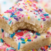 stack of sugar cookie bars with bite taken out