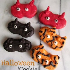 nutter butter cookies decorated to look like halloween masks: devils, cats, tigers