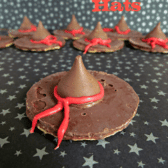 witch hat cookies - chocolate pinwheel cookie upside down with hersheys kiss and red frosting bow