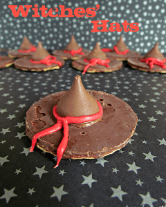 witch hat cookies - chocolate pinwheel cookie upside down with hersheys kiss and red frosting bow