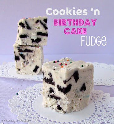white chocolate fudge with chunks of oreos on white doily and purple background