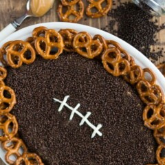overhead shot of peanut butter football dip with words