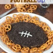 overhead shot of football dip on plate with pretzels