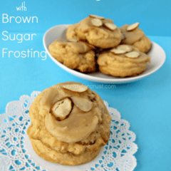 Almond Pudding Cookies with Brown Sugar Frosting on doily and white plate