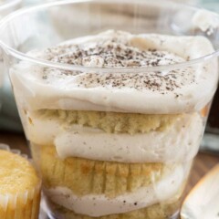 plastic cup with slices of cupcake layered with tiramisu filling