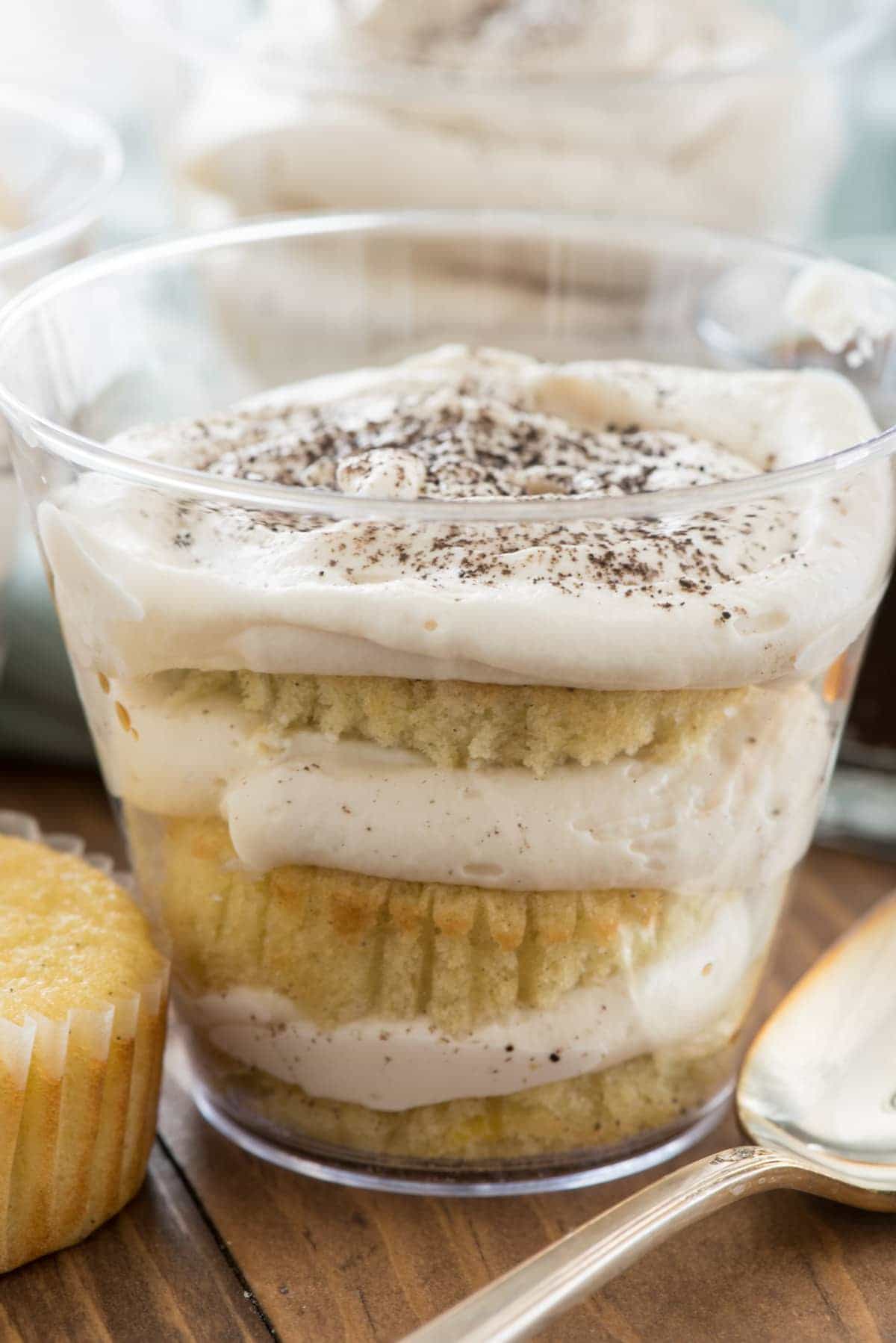 Easy Tiramisu Cups to go - this easy recipe uses simple ingredients you already have at home! Make it in plastic cups for the perfect potluck dessert! Everyone loves these at parties.