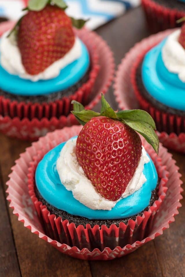 red white and blue cupcake topper on chocolate cupcake