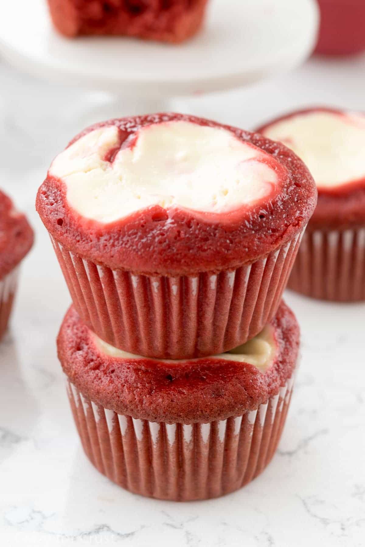 Red Velvet Cheesecake Cupcakes - an easy red velvet cupcake recipe, filled with cream cheese, and topped with cream cheese frosting!