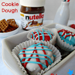 patriotic nutella cookie dough dipped pretzels in a white dish with title