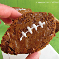 Nutella peanut butter football brownie being held by a woman.