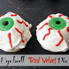 white, red and green eyeball pie laying on a spiderweb background with graphic title on the bottom