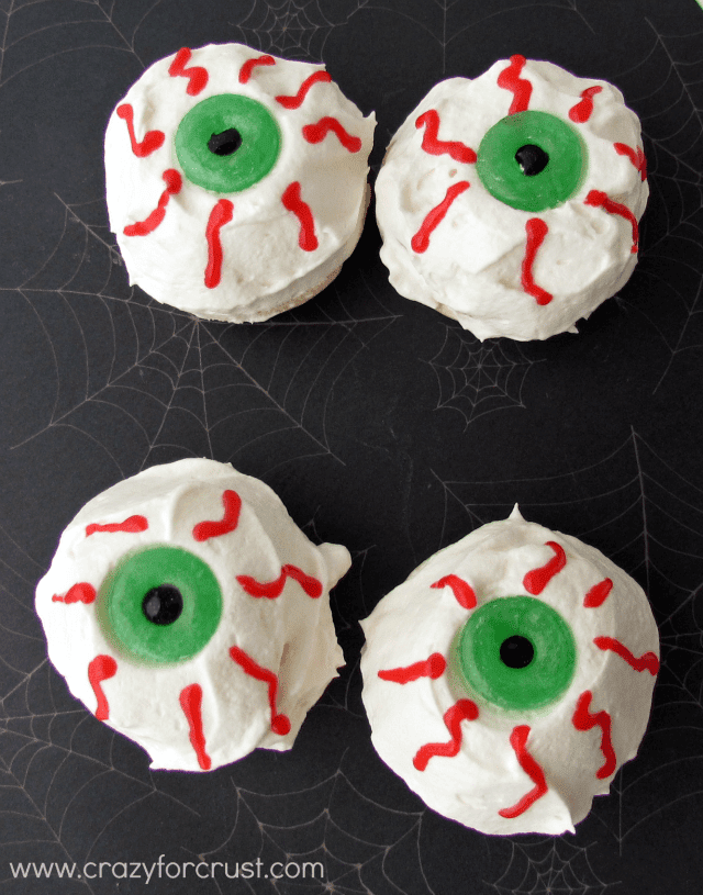 Red Velvet Eyeball Pies with whipped cream and red frosting eyes with lifesaver pupils