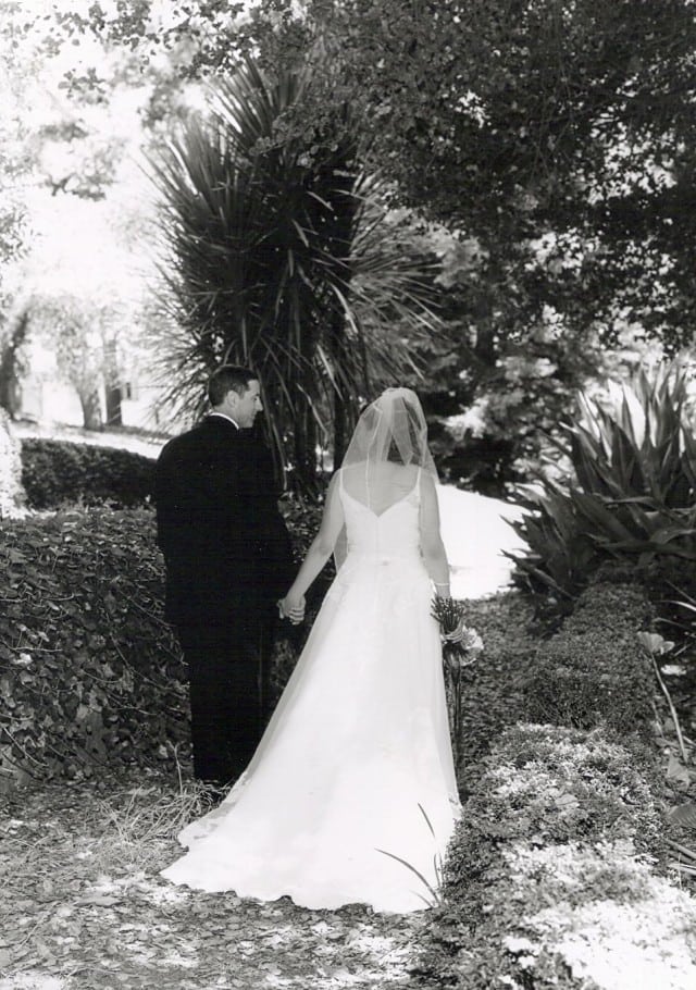 bride and groom walking away from camera