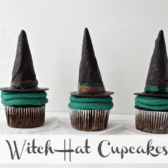 witch hat cupcakes on top of white doilies with white background