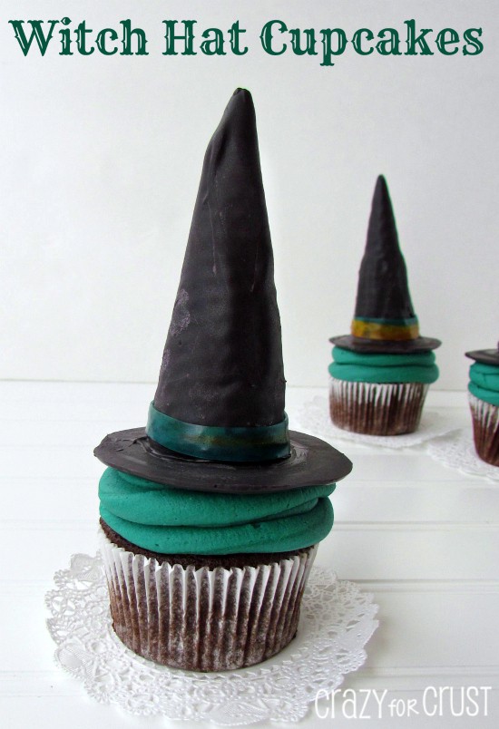 Witch Hat Cupcakes filled with candy corn on top green frosted cupcakes on white background