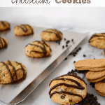 Nutter butter cheesecake cookies toped with melted chocolate o a silver baking sheet, with graphic image of the top.