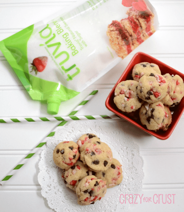 peppermint chocolate chip cookies in a pile with truvia behind on white backgroud