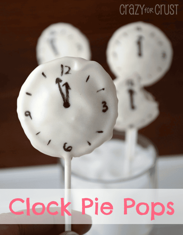 clock pie pops with white chocolate coating and clock face drawn on them with words on photo
