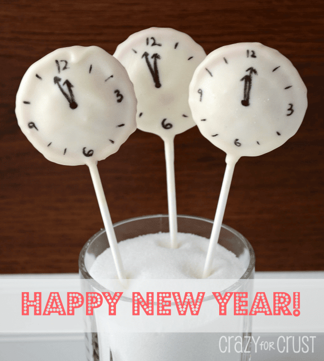 clock pie pops with white chocolate coating and clock face drawn on them