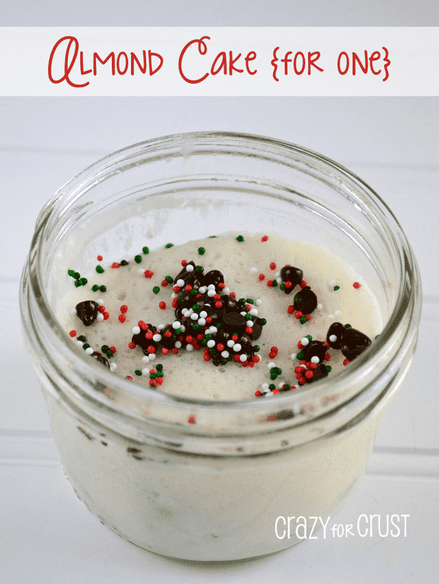 almond cake in a jar with christmas sprinkles and words on photo