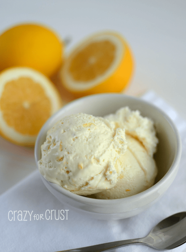 easy skinny lemon ice cream in white bowl on white napkin with lemons