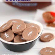 chocolate football conversation hearts on white background and bowl with coco powder and football