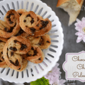 Chocolate Chip Palmiers on white platter with flowers around