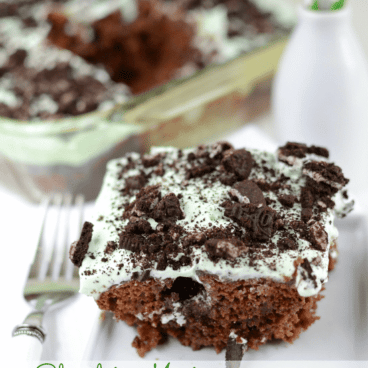 Chocolate Mint Poke Cake on white plate with fork