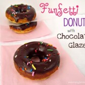 funfetti donuts with chocolate glaze and sprinkles on pink napkin