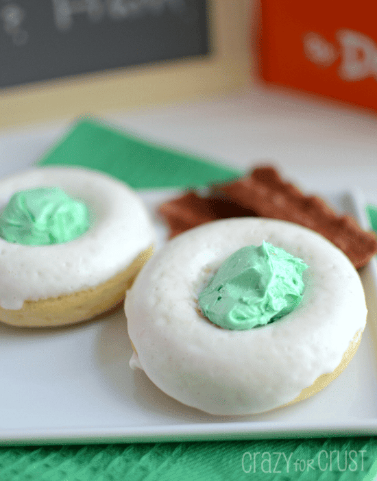 green eggs donuts on white plate