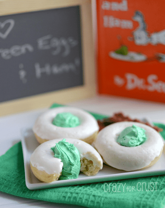 green eggs donuts on white plate
