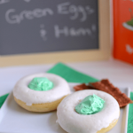 green eggs donuts on white plate