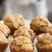 cupcakes on stand with dog behind