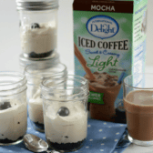 skinny mocha no bake cheesecake in glass jar with crust