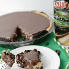 baileys irish creamer cheesecake pie with slice on white plate