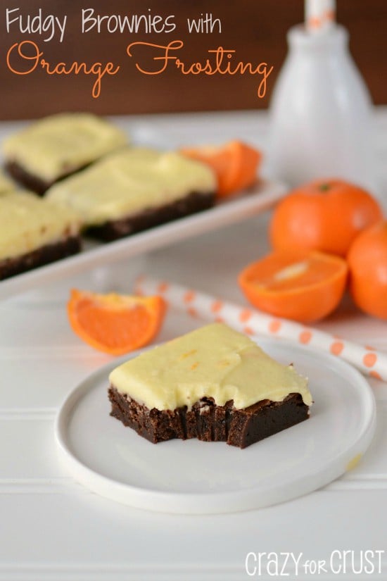 Fudgy Brownies with Orange-Frosting on white plate with title