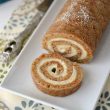 Carrot-Cake-Roll with one slice on a plate