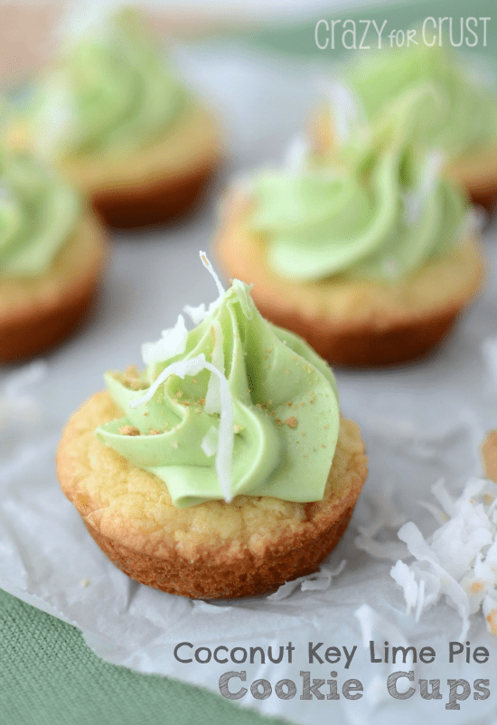 coconut cookie cups with lime buttercream on parchment paper