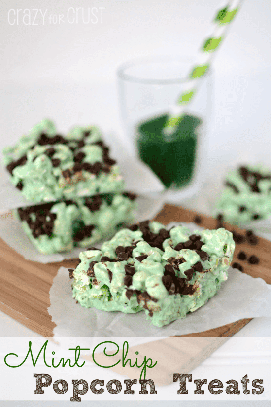 mint chocolate popcorn treats on parchment on cutting board