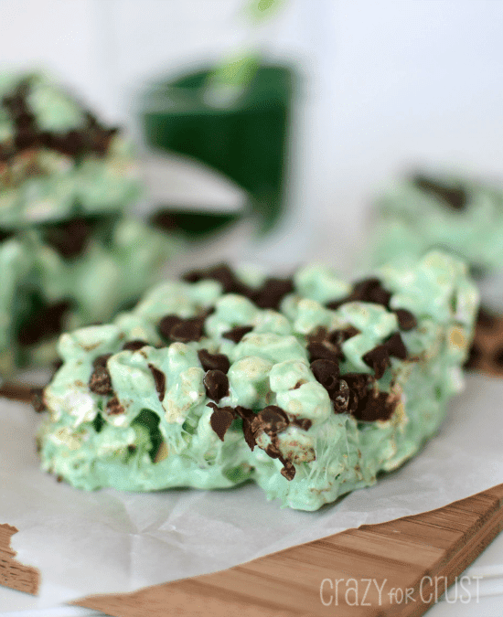 mint chocolate popcorn treats on parchment on cutting board