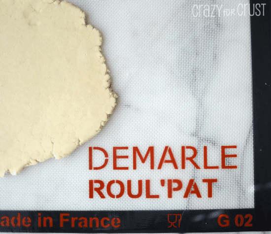 rolled out pie crust on roulpat