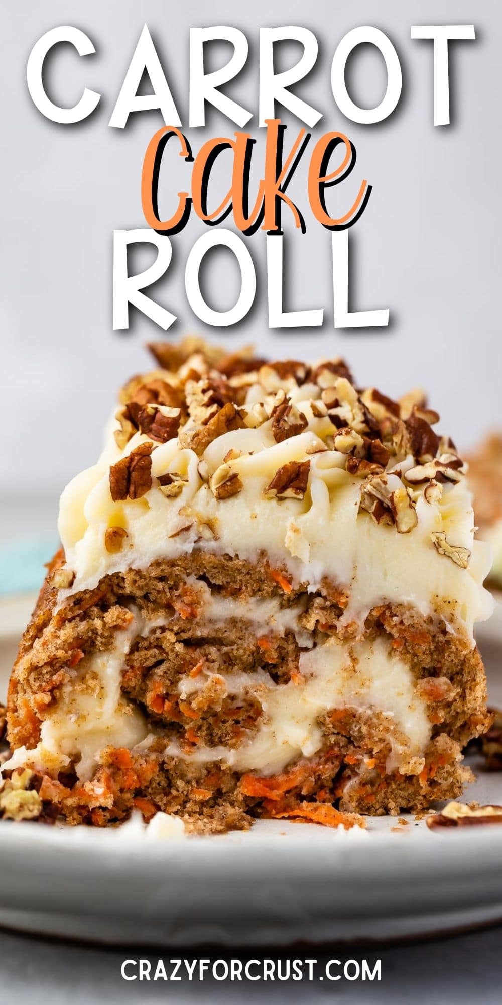 carrot cake roll on white serving dish