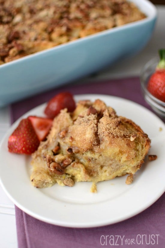 banana baked french toast on white plate with berries