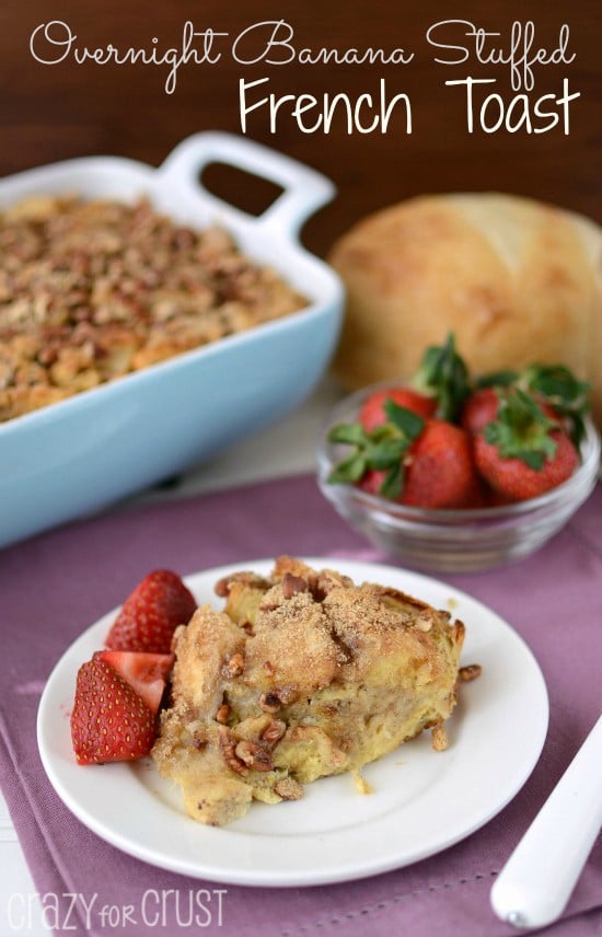 banana baked french toast on white plate with berries