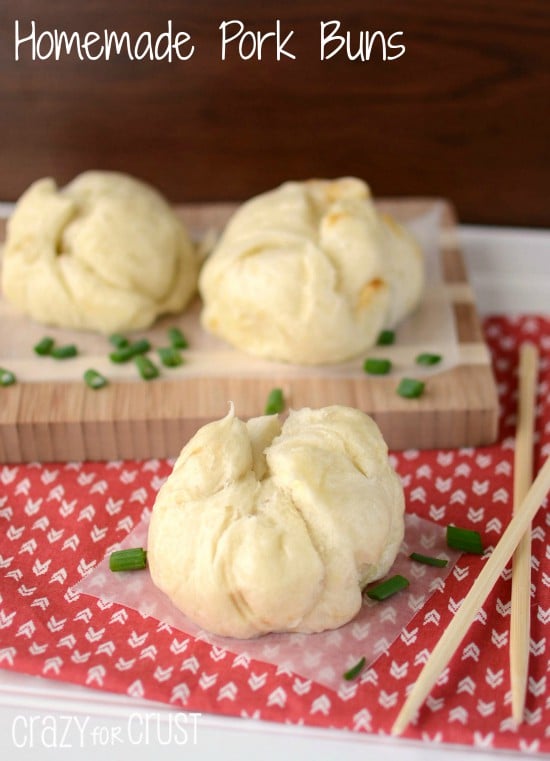 pork buns on parchment and patterned napkin with chopsticks